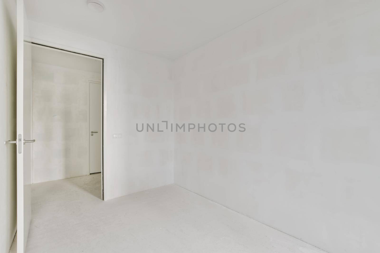 Modern room with wooden floor and white walls