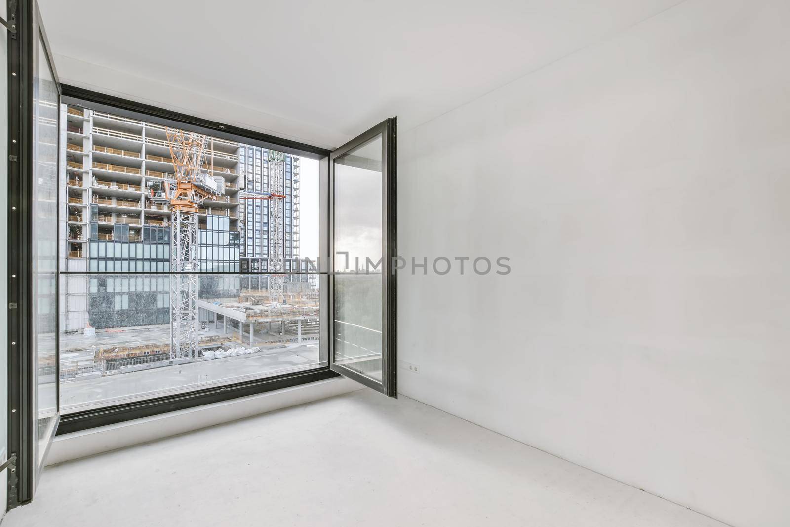 Modern room with wooden floor and white walls