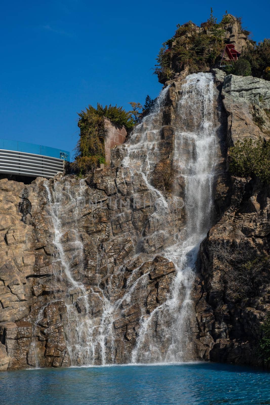 Waterfall with stream running river  by Elet