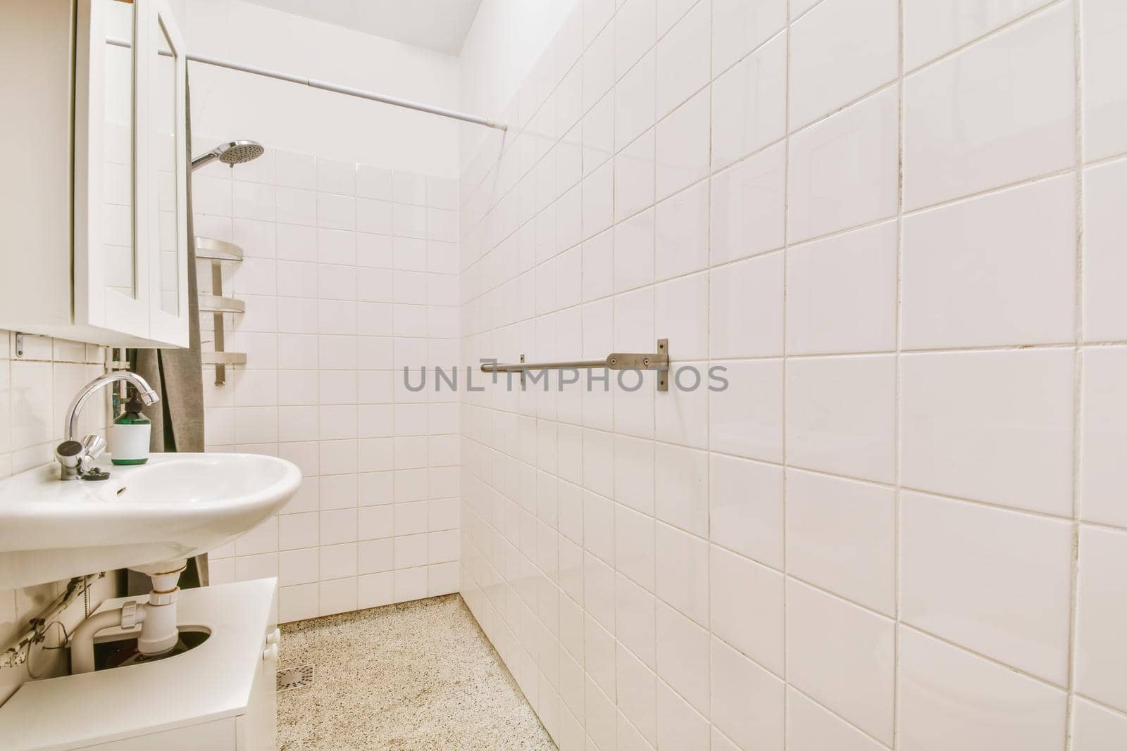 Long narrow bathroom with shower at the beginning