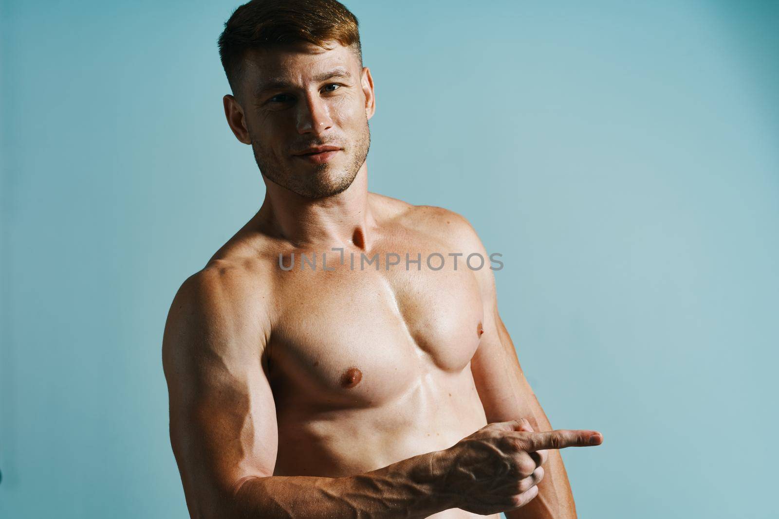 male with bulging topless muscle workout posing bodybuilder. High quality photo