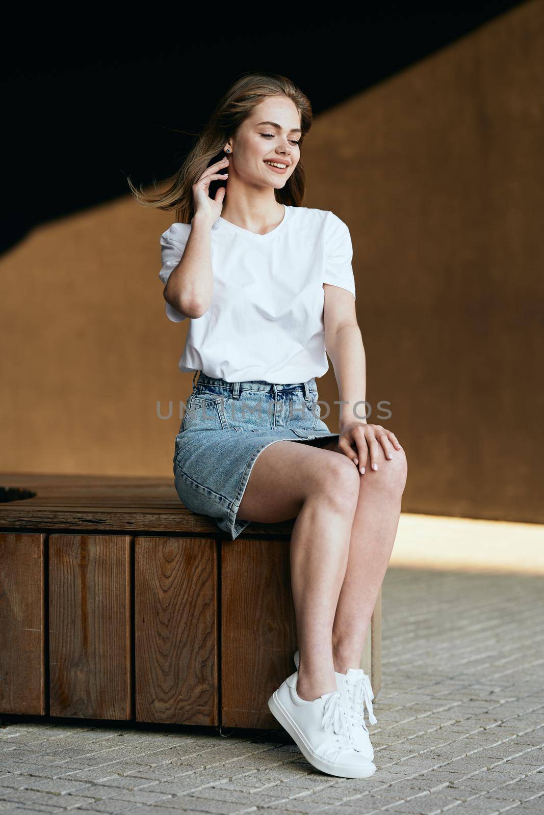 woman in white t-shirt on dark background fun posing fashion by Vichizh