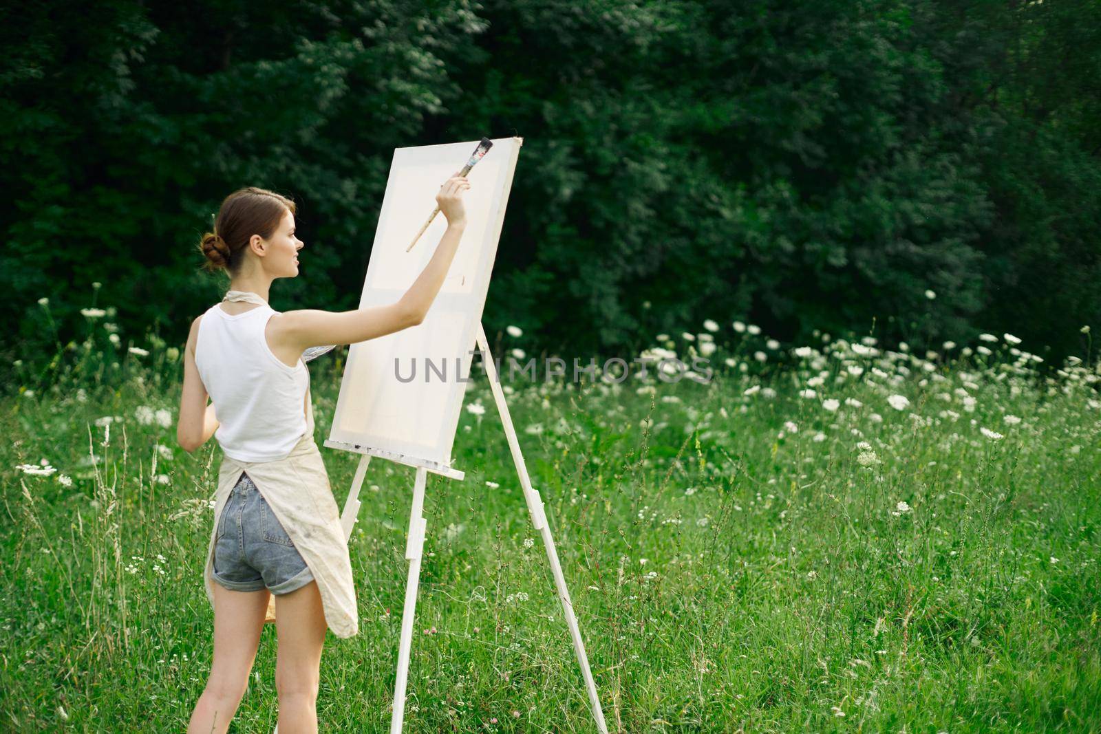 woman artist drawing landscape nature drawing creative. High quality photo