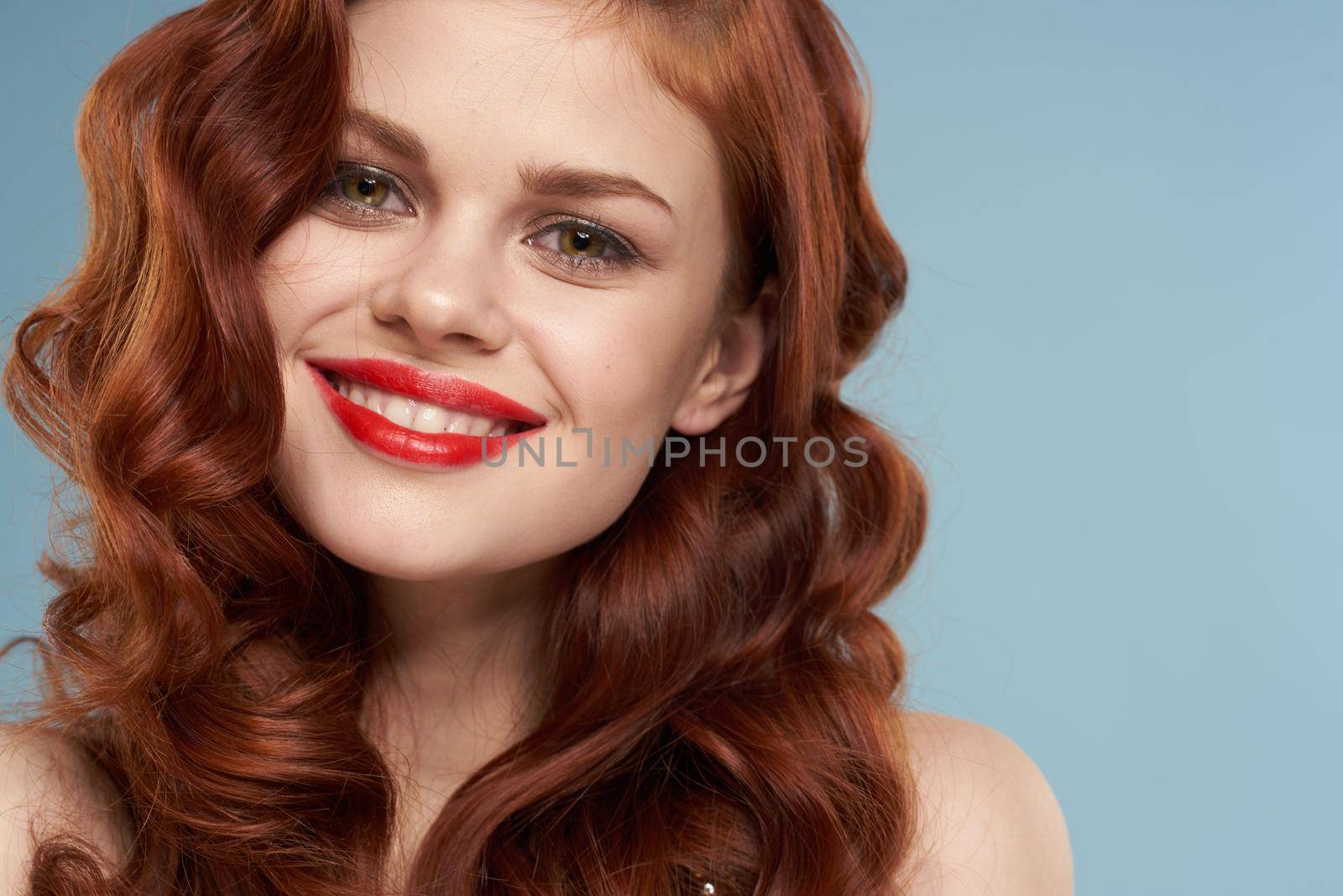attractive red-haired woman red lips face close up. High quality photo
