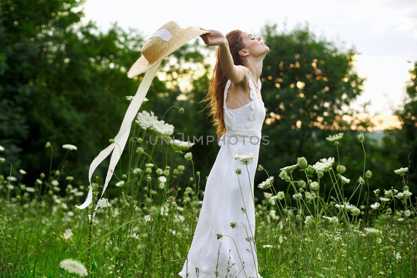 Woman in white dress flowers freedom walk fresh air. High quality photo