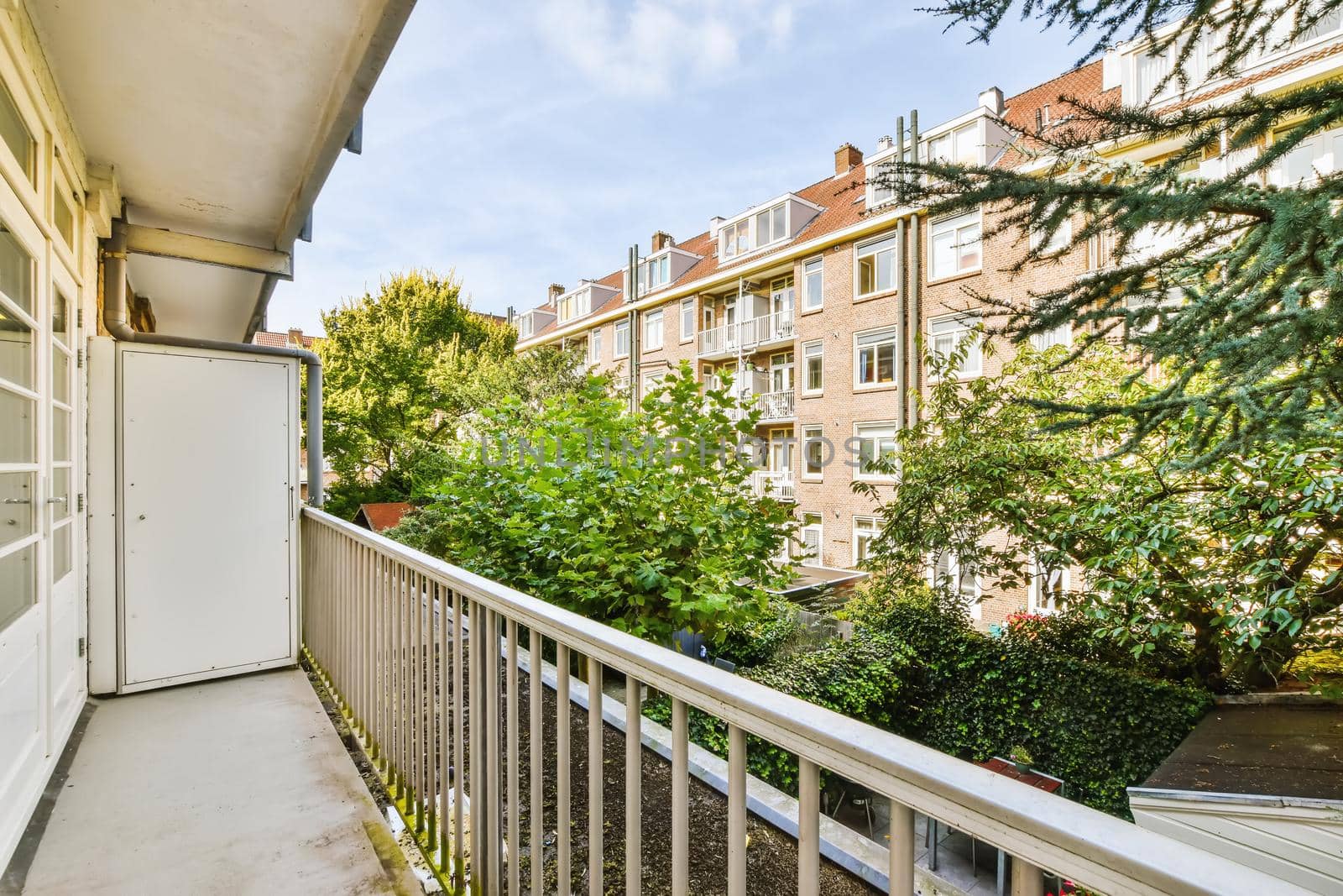 Attractive long narrow balcony with wooden handrails
