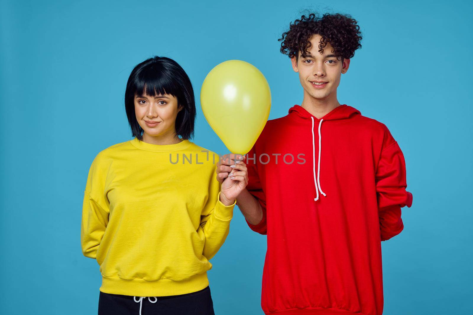 young couple in fashionable clothes posing together emotions lifestyle. High quality photo