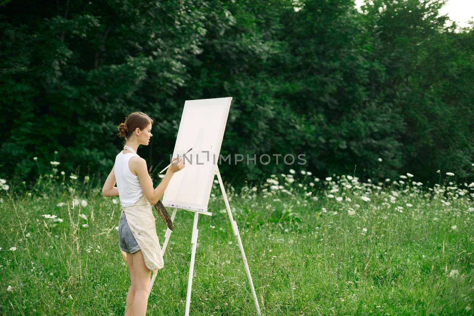 woman artist drawing landscape nature drawing creative. High quality photo