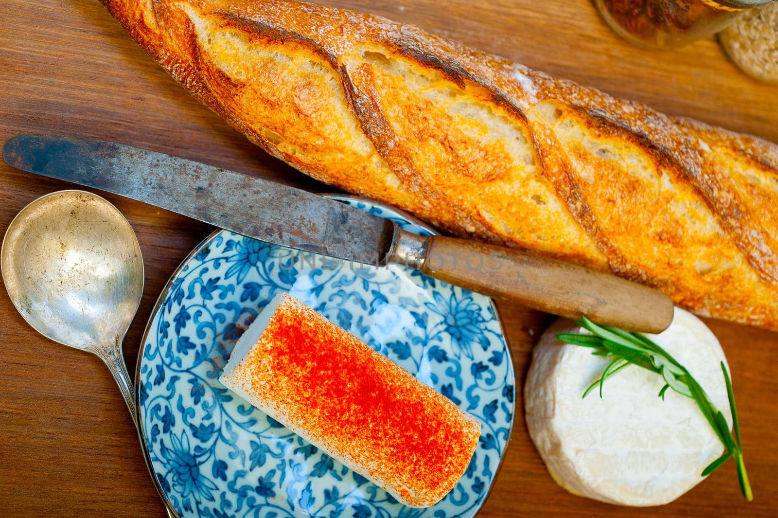 French cheese and fresh  baguette on a wood cutter