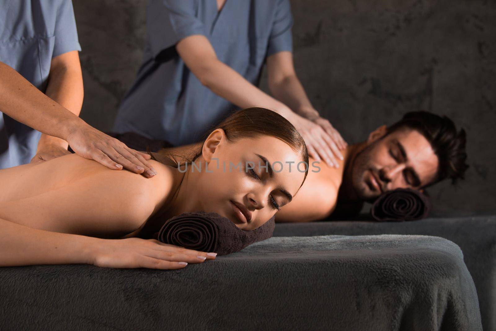Couple having spa massage by ALotOfPeople