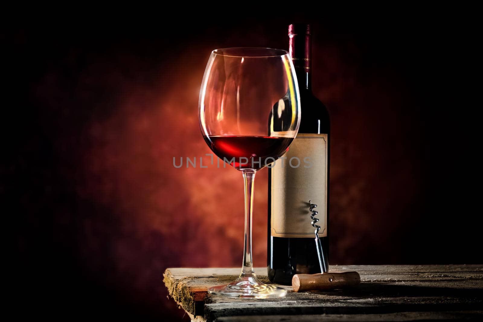 Wine on a wooden table in dark colors