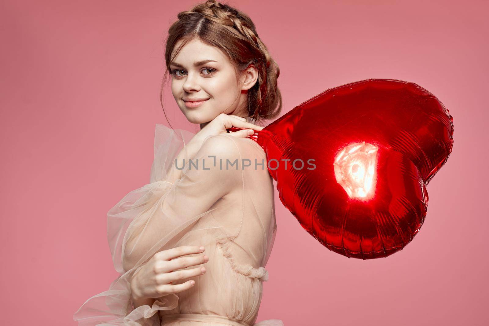 portrait of a woman in a dress balloon Valentine's Day model studio. High quality photo