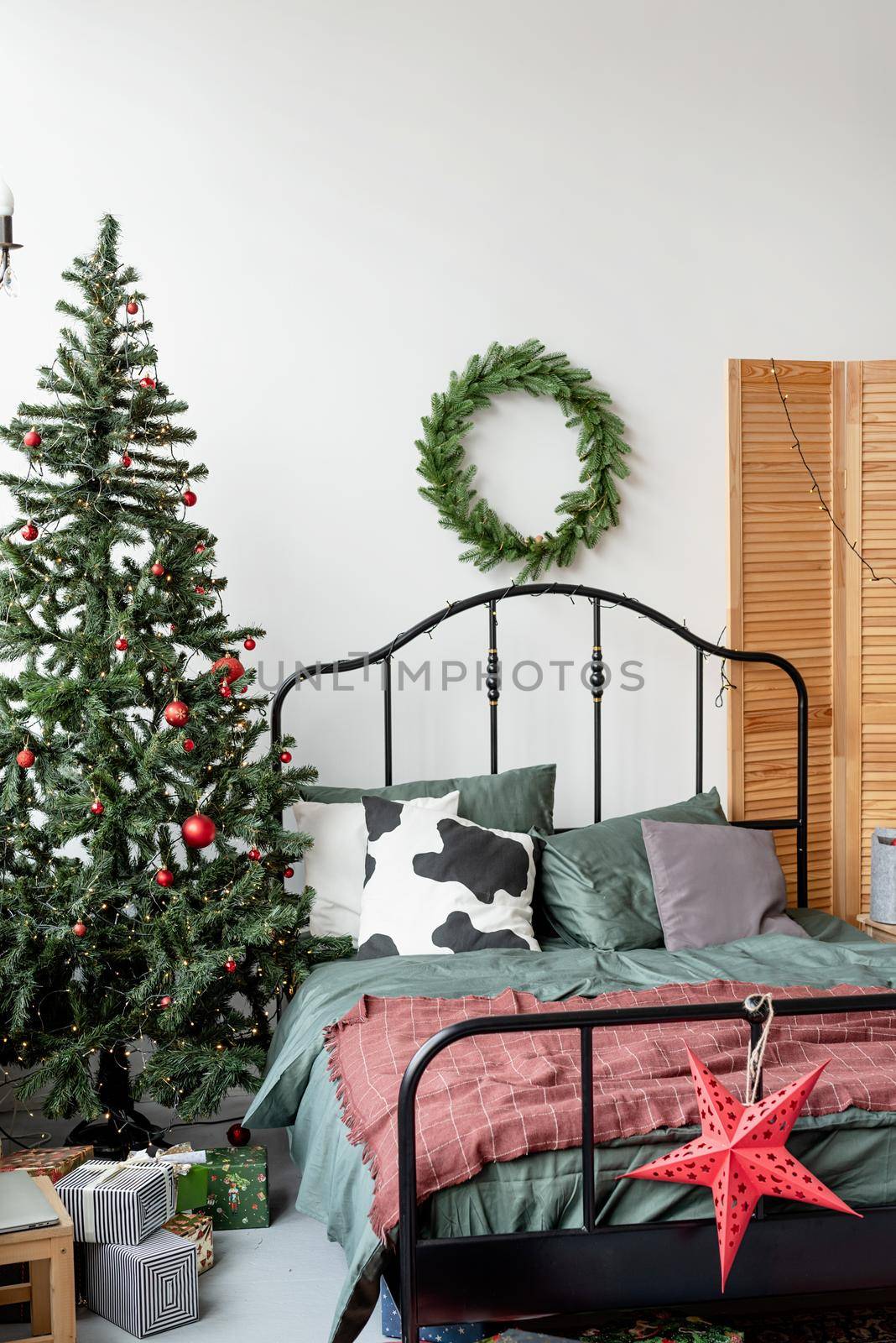 Merry Christmas and Happy New Year. beautiful cozy bedroom decorated for Christmas