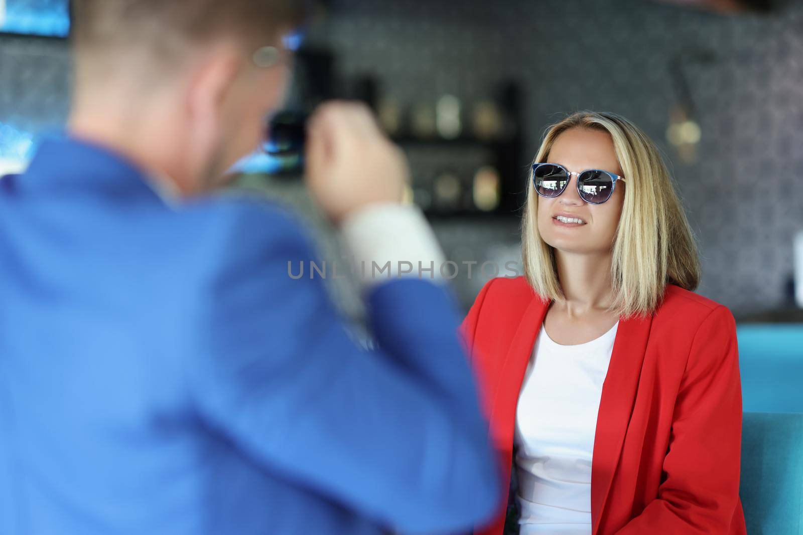 Portrait of stylish dressed woman on meeting with presentable man, consultant give advice. Successful people discuss something. Business meeting concept