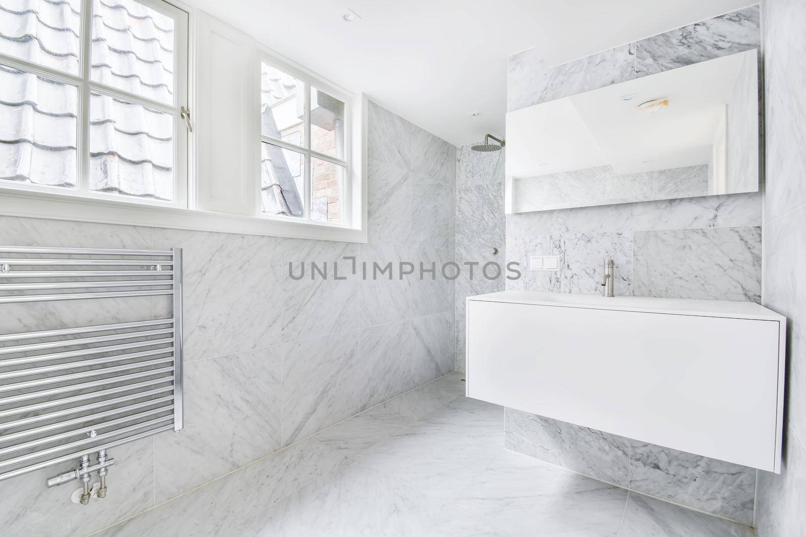 An elegant bathroom interior with big mirror