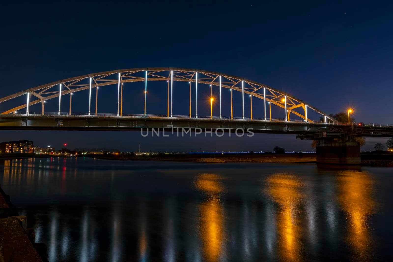 The Wilhelmina bridge at the river IJssel near Deventer in the Netherlands at night