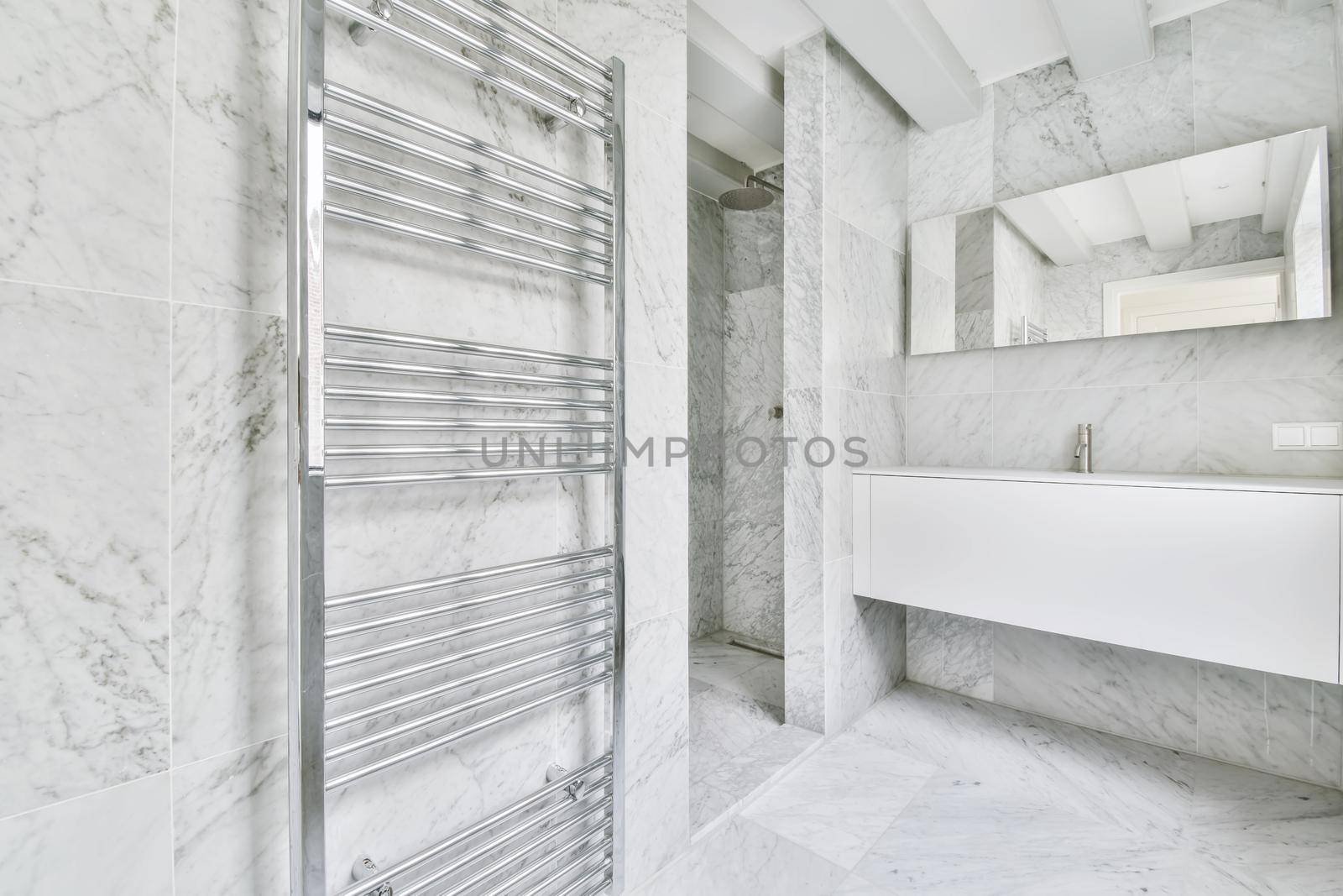 An elegant bathroom interior with big mirror