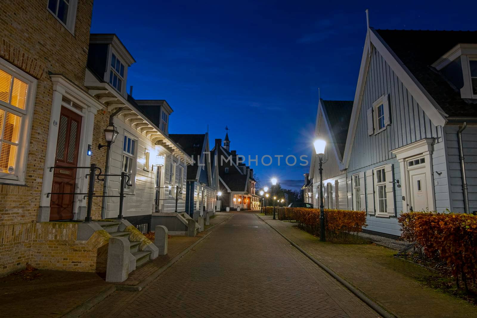 Old dutch wooden houses in Friesland the Netherlands by night in christmas time by devy