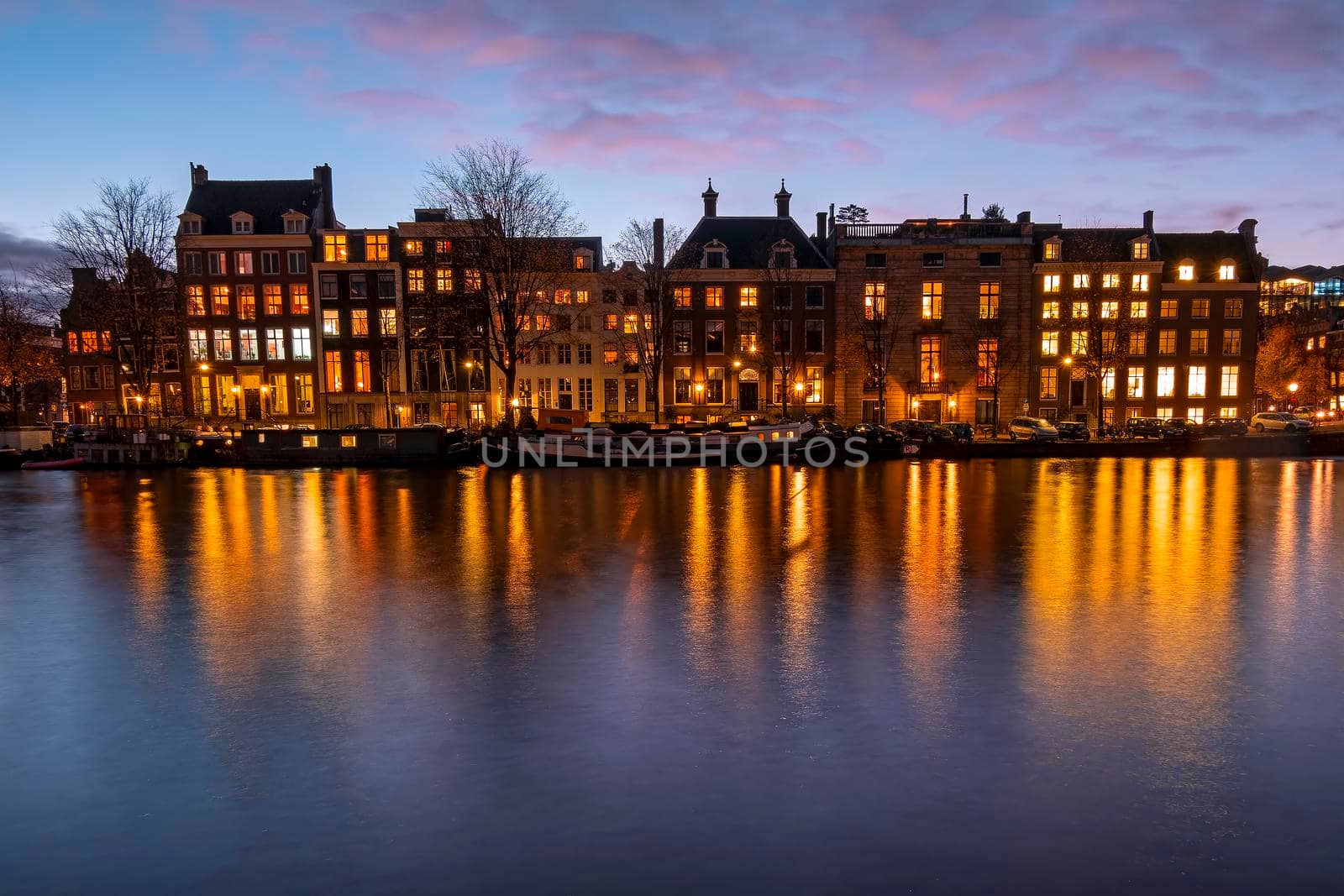 City scenic from Amsterdam at the Amsteldijk in the Netherlands at sunset by devy