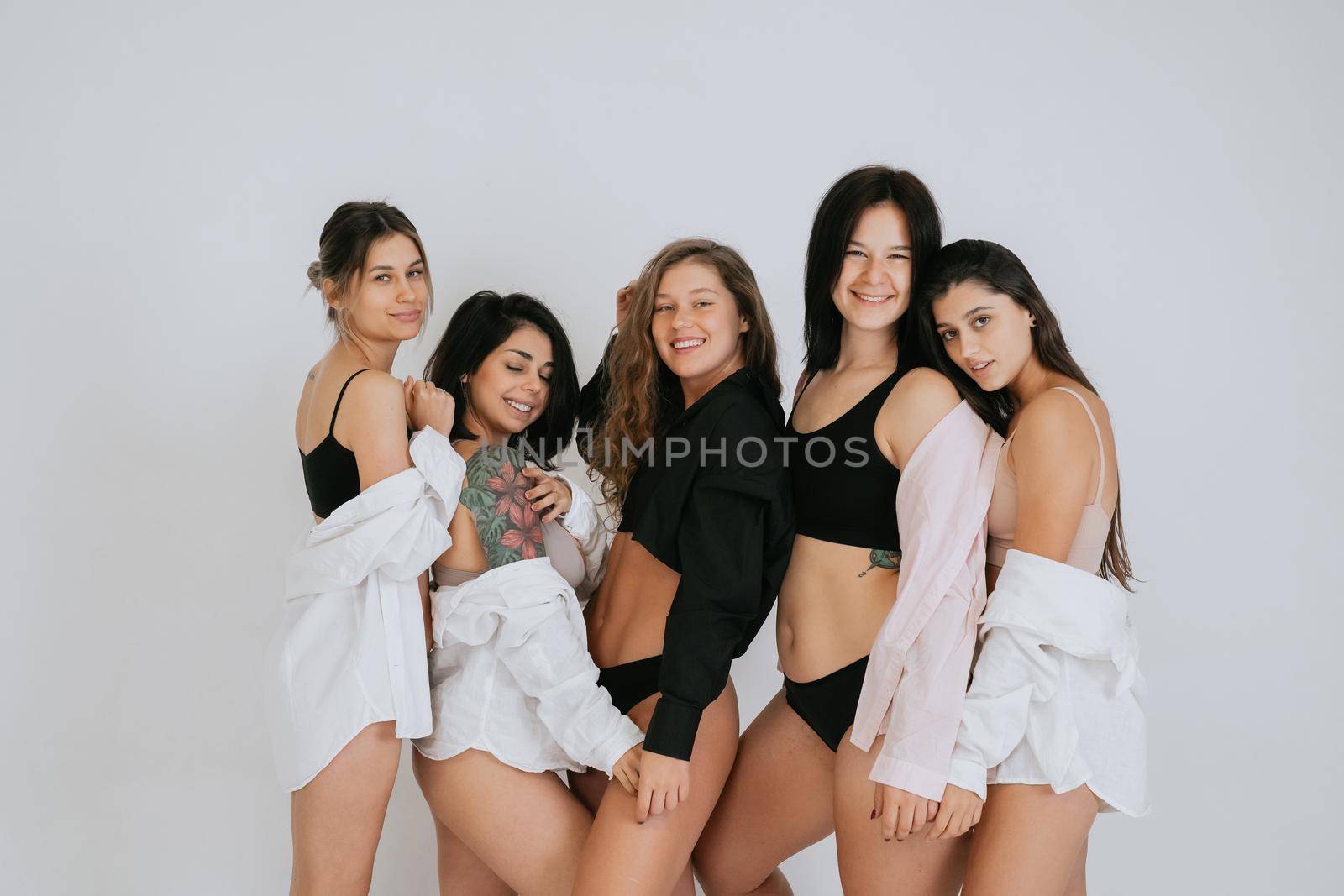 diverse models wearing comfortable underwear, enjoying time together by teksomolika