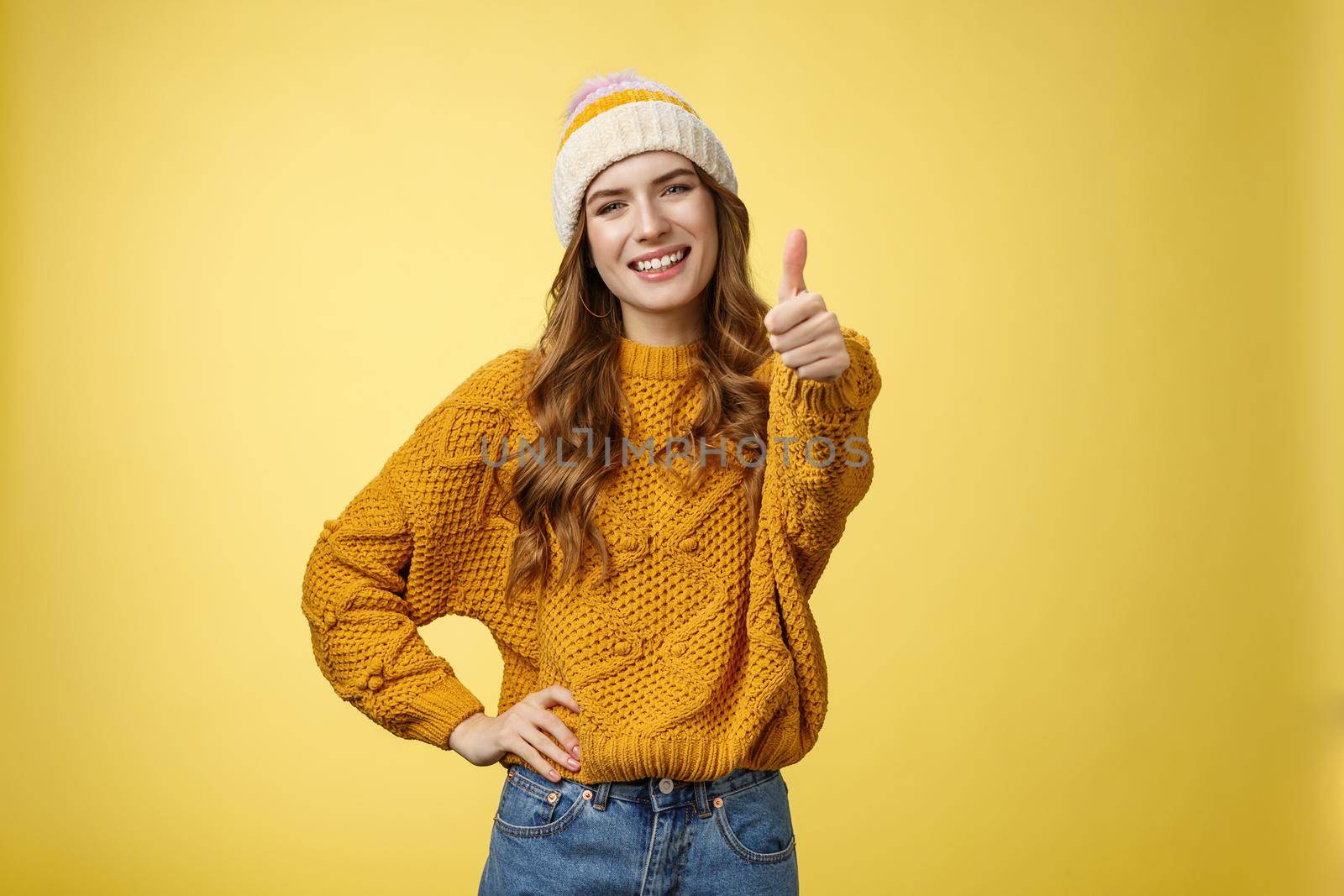 Lucky good-looking friendly supportive girlfriend congratulating you nice work good job show thumb-up gesture satisfied liking awesome product recommend promotion, smiling yellow background by Benzoix