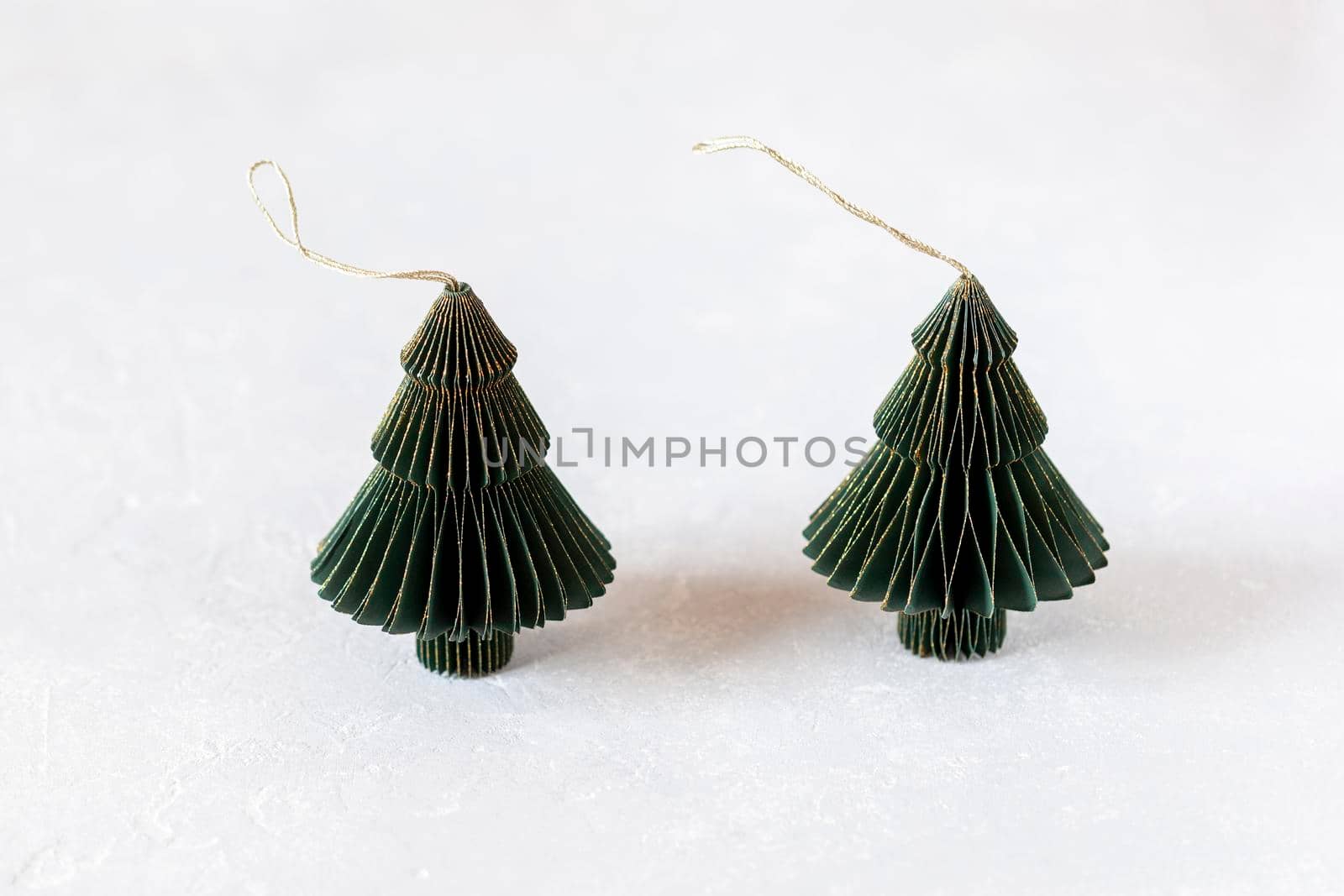 New Year and Christmas paper green and golden decorative trees, zero waste concept