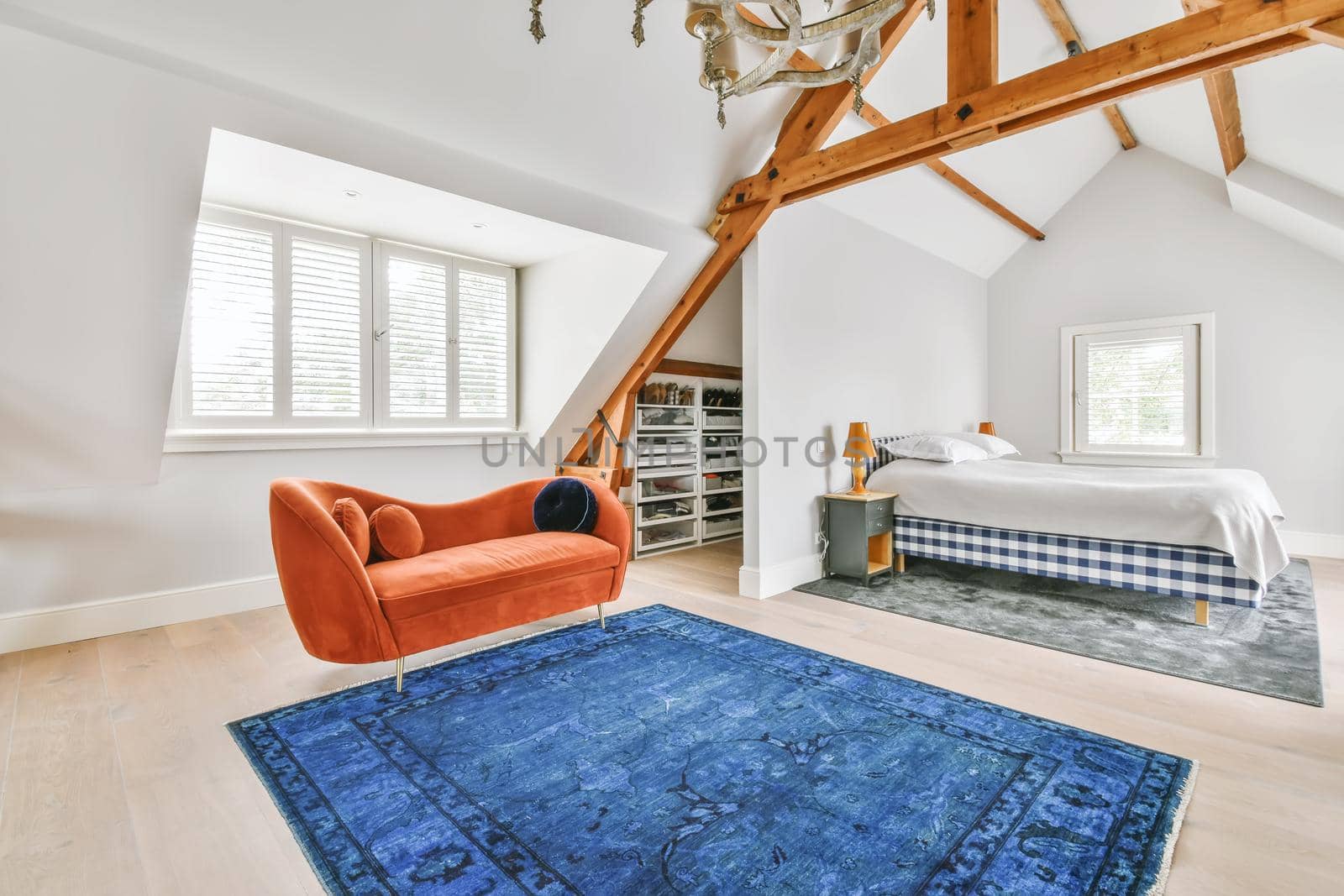 Cozy bright room with a bright red sofa in the middle