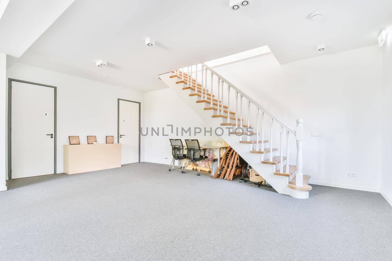 Straight white staircase to the second floor