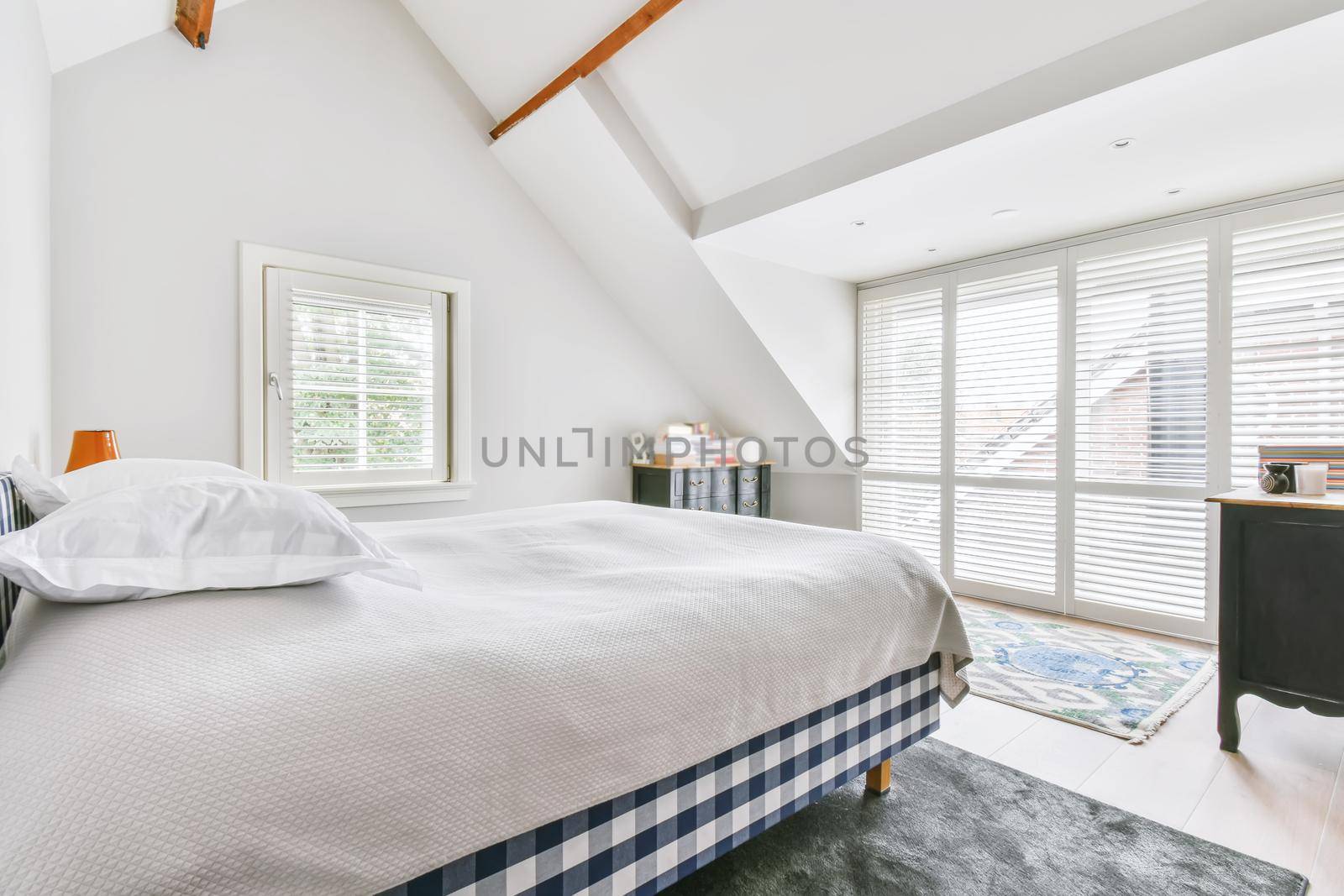 Bedroom in a minimalist style with a double bed