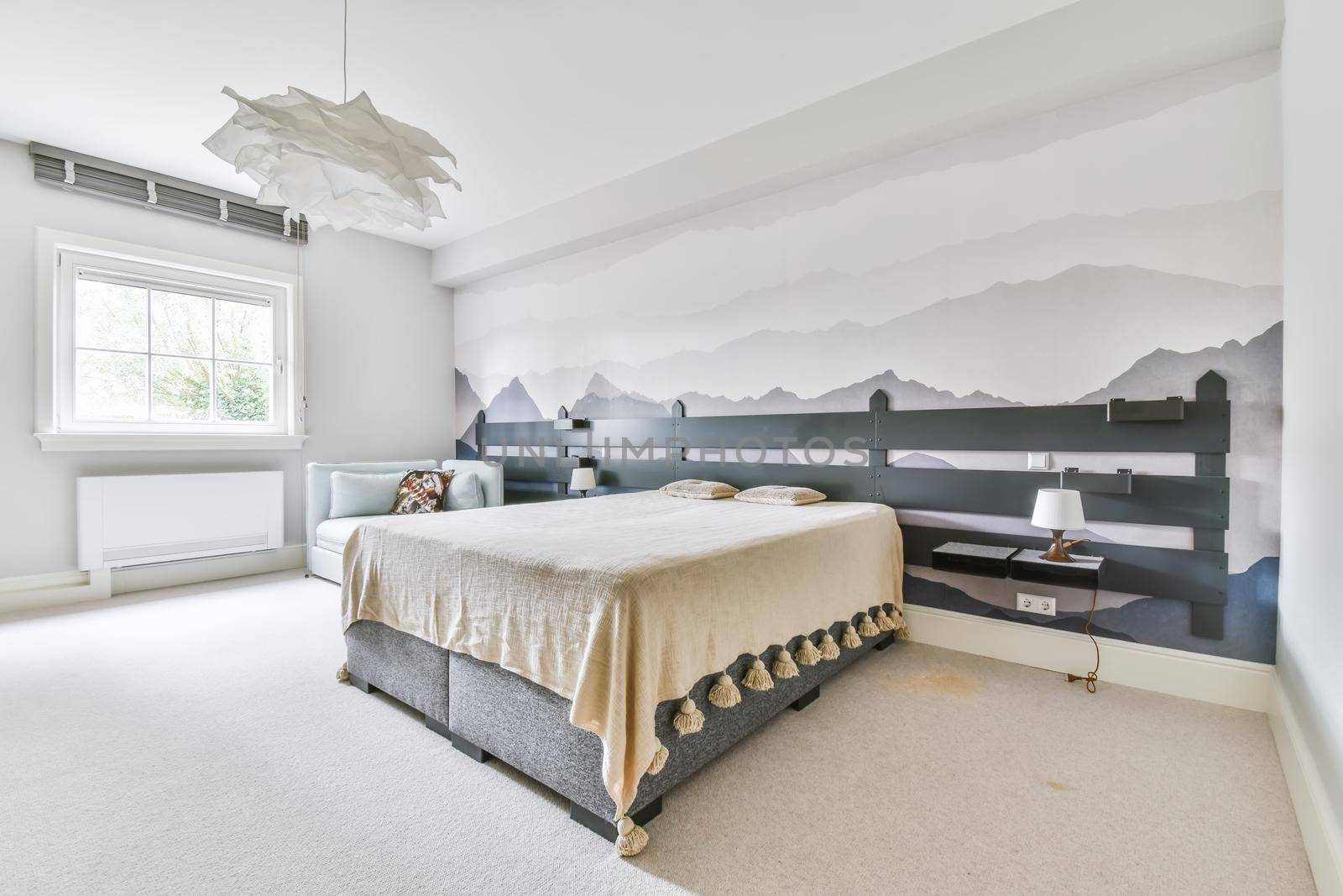 Bedroom in a minimalist style with a double bed