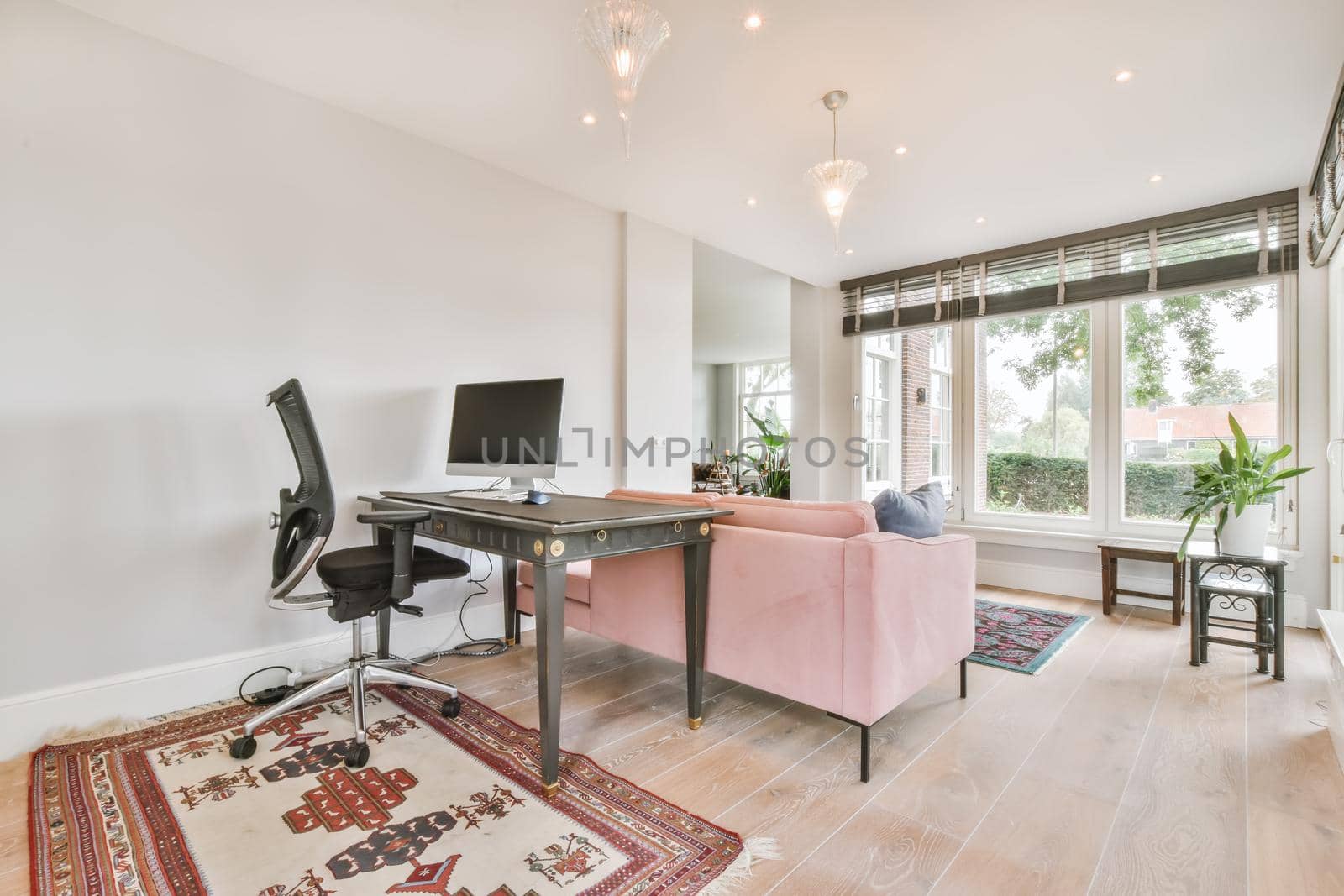 Working area in a cozy room with a computer desk