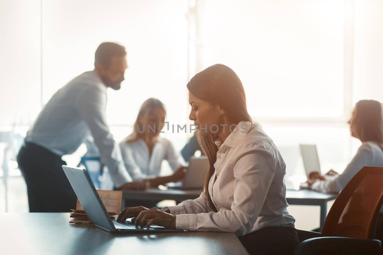 Executive business people is in teamwork with freelancer woman working using laptop in modern workplace office. Corporate business team concept.