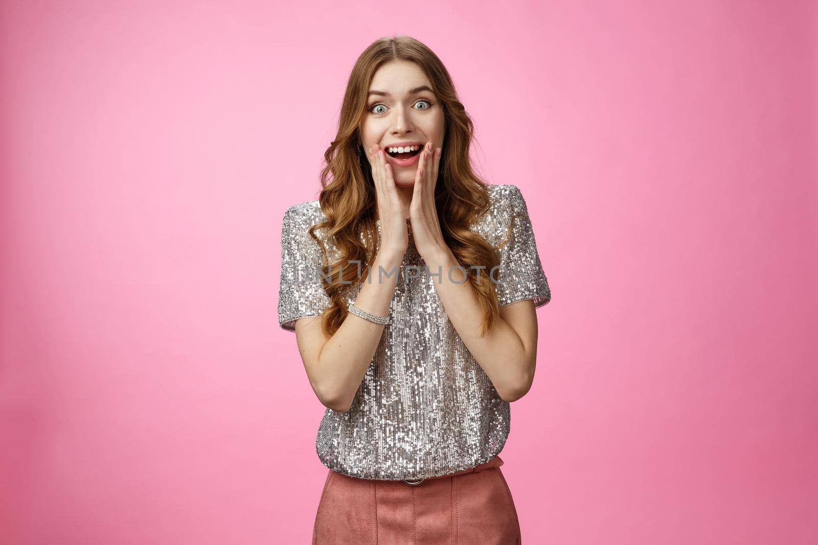 Impressed attractive caucasian charming girlfriend sighing thrill joy drop jaw amazement widen eyes see celebrity press palms cheeks expressing excitement surprise, standing pink background.