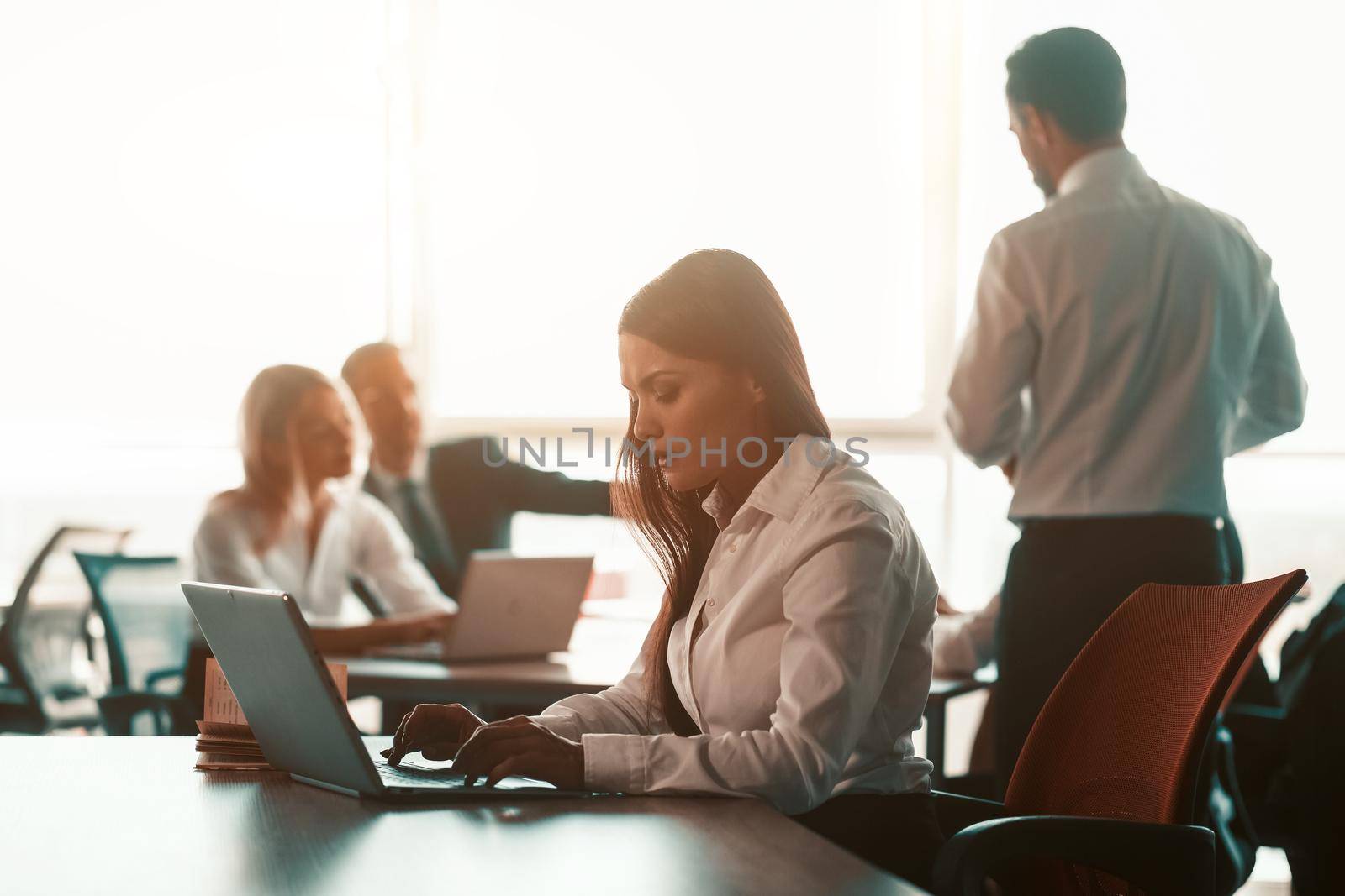 Executive business people is in teamwork with freelancer woman working using laptop in modern workplace office. Corporate business team concept by LipikStockMedia