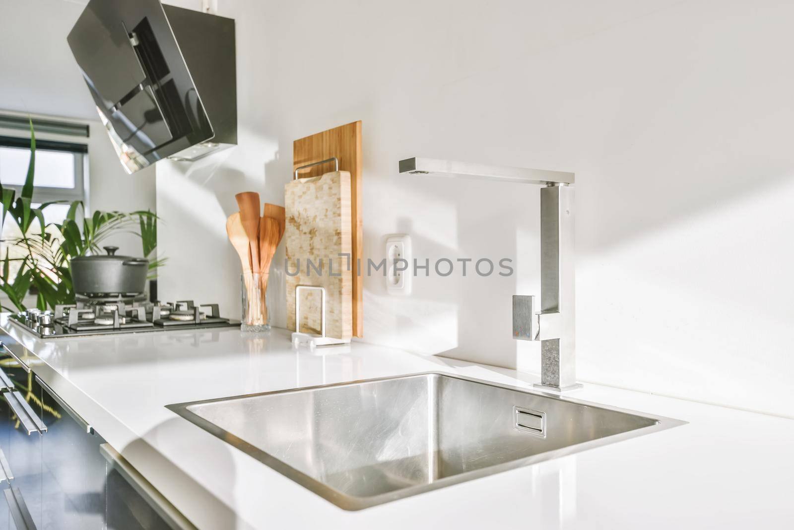 Attractive kitchen with stylish and modern black range hood