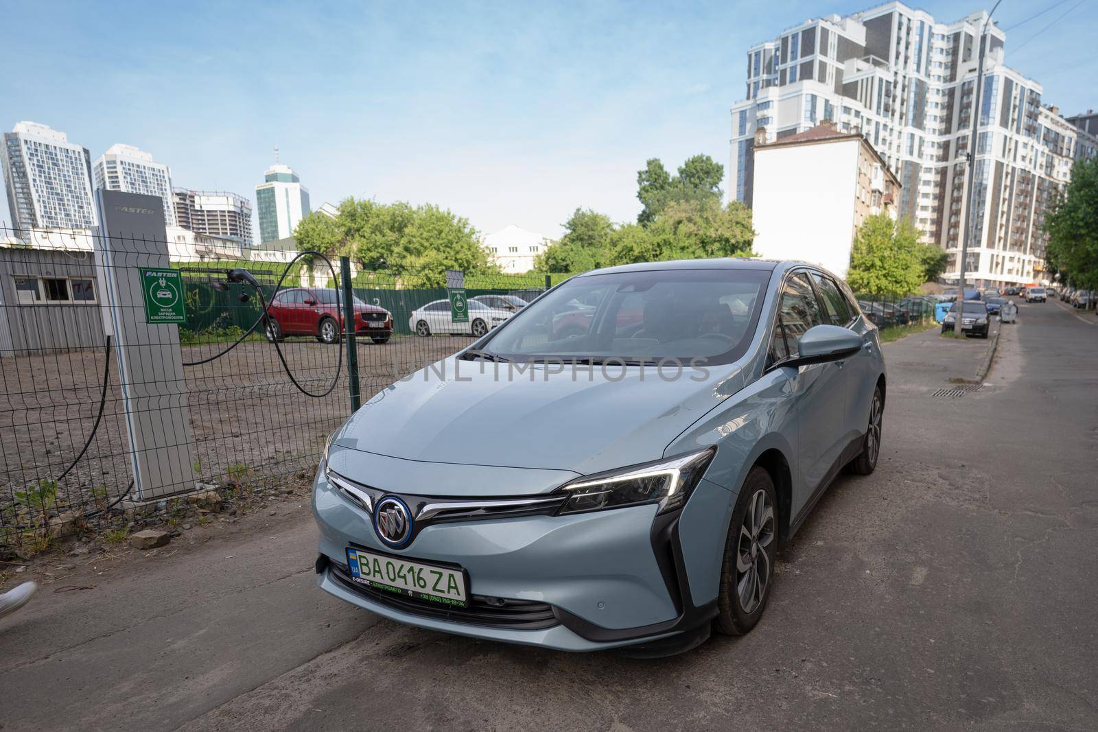 Front view Chinese Electric vehicle Buick VeLite 6 on streets of Kyiv, near EV charging station. General Motors family next generation electric car based on Chevrolet Bolt technology . 17th of june 2021 Kyiv, Ukraine,. High quality photo