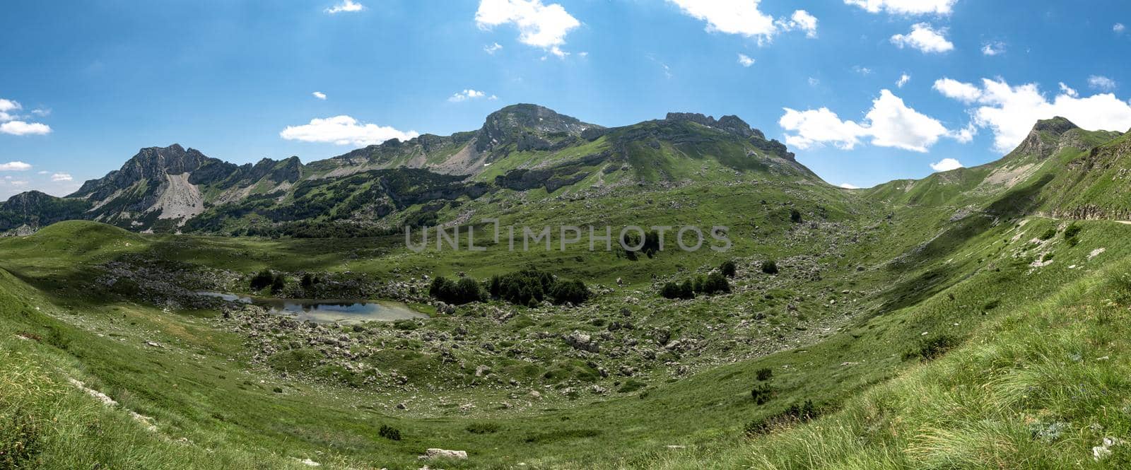 The mountain pass Sedlo is in the north of Montenegro. Fantastic green view of Saddle mountain, Durmitor massive, Montenegro by Andrii_Ko