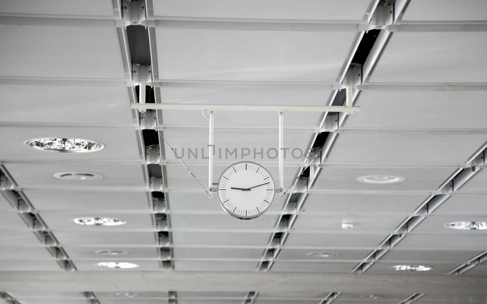 Hanging white clock at the big train station by BEMPhoto