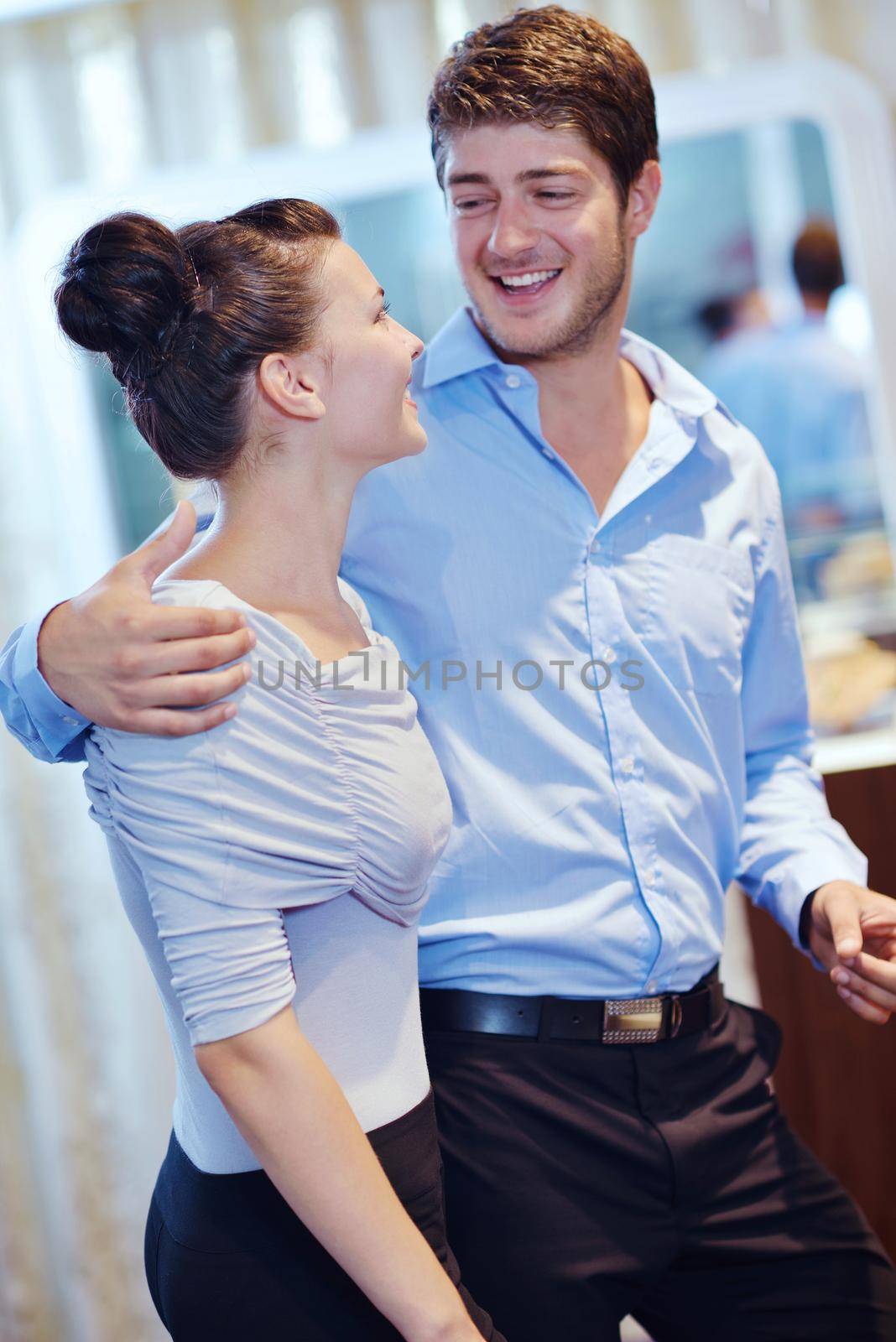 happy young couple in jewelry store by dotshock