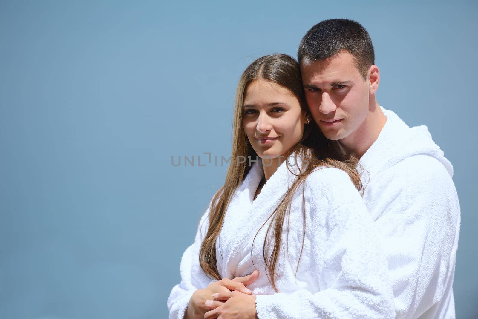 Romantic young couple spending time together and relaxing on yacht