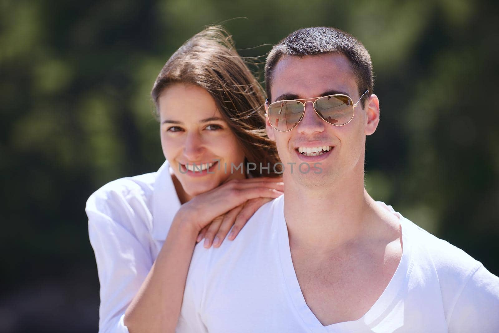 happy young couple have fun and relax  on the beach