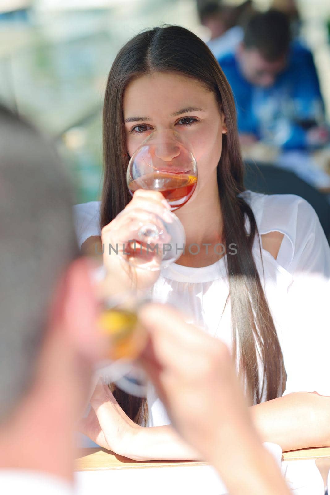 happy young couple having lanch at beautiful restaurant on by the sea on  beach