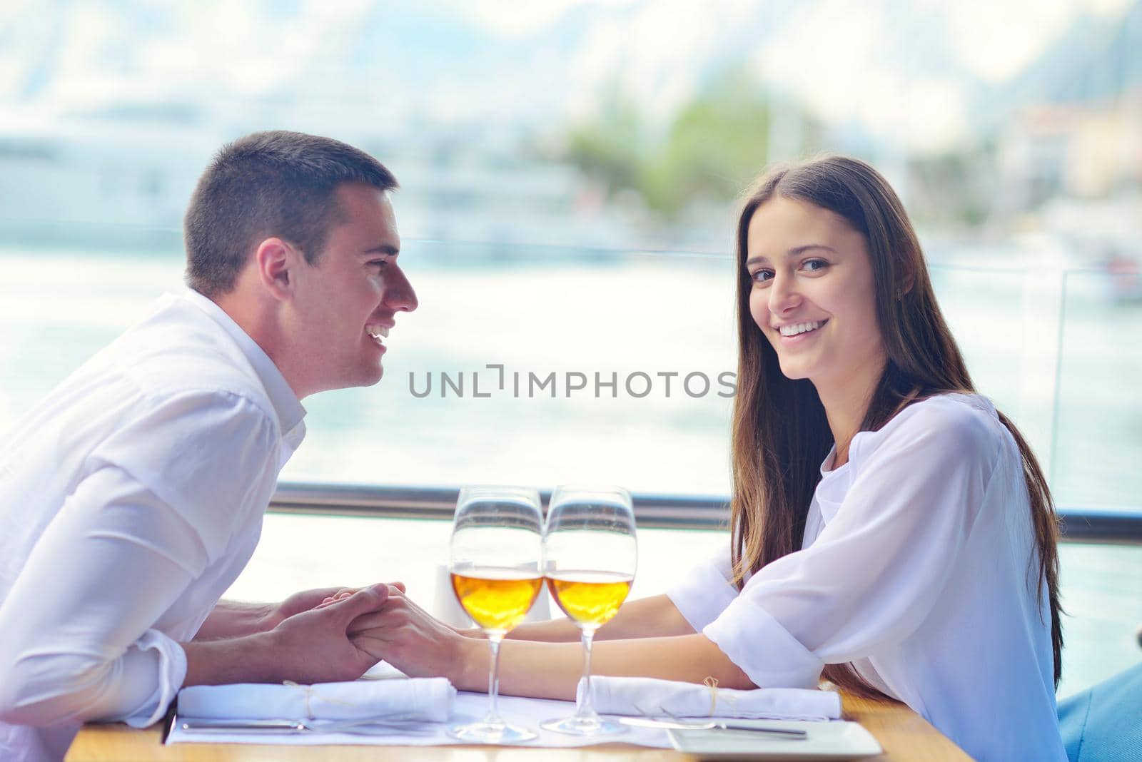 couple having lanch at beautiful restaurant by dotshock