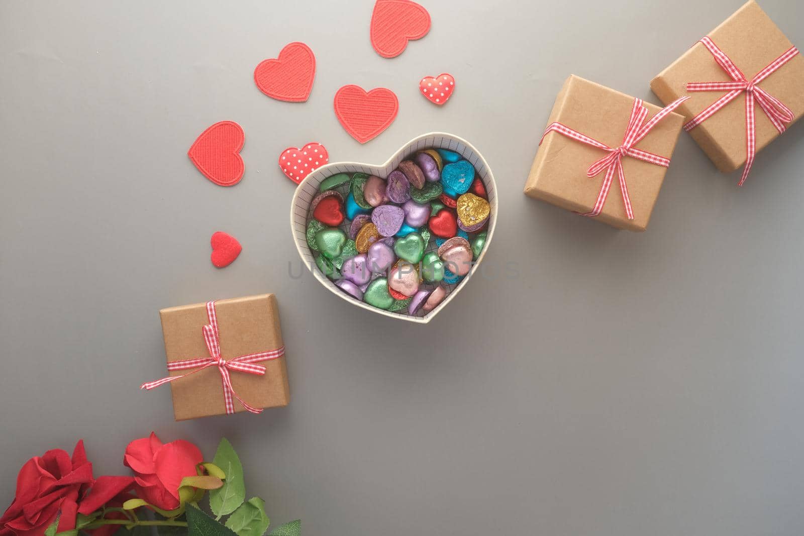 heart shape gift , rose flower on table ,