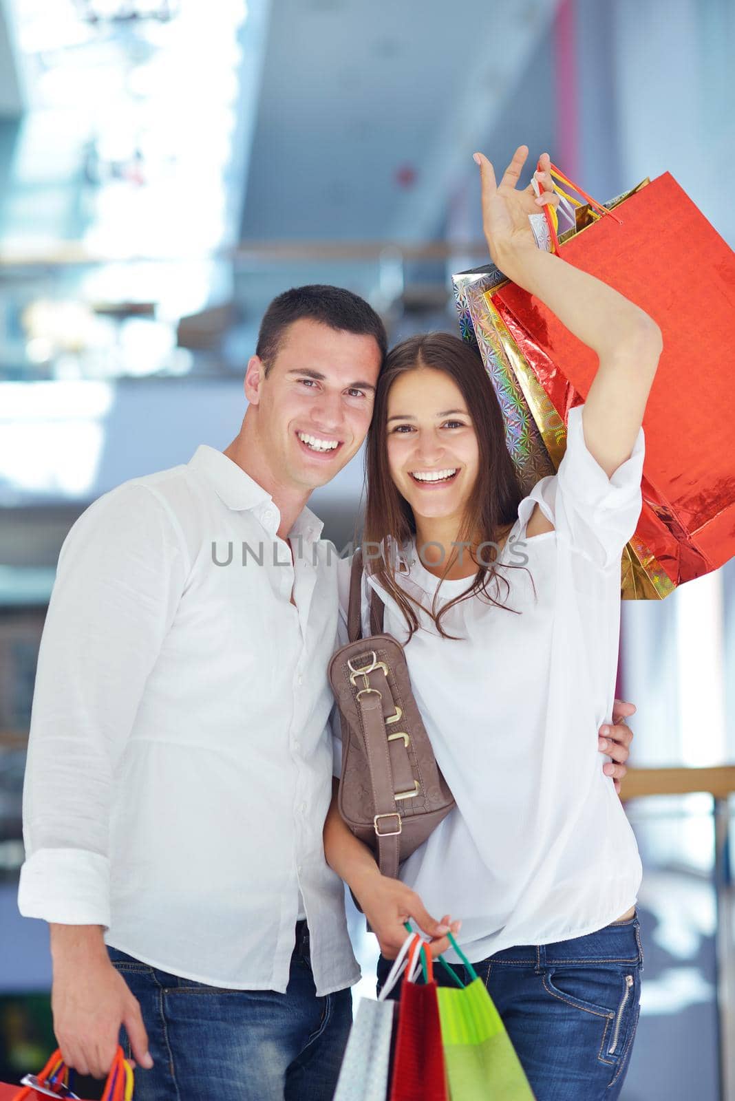happy young couple in shopping by dotshock