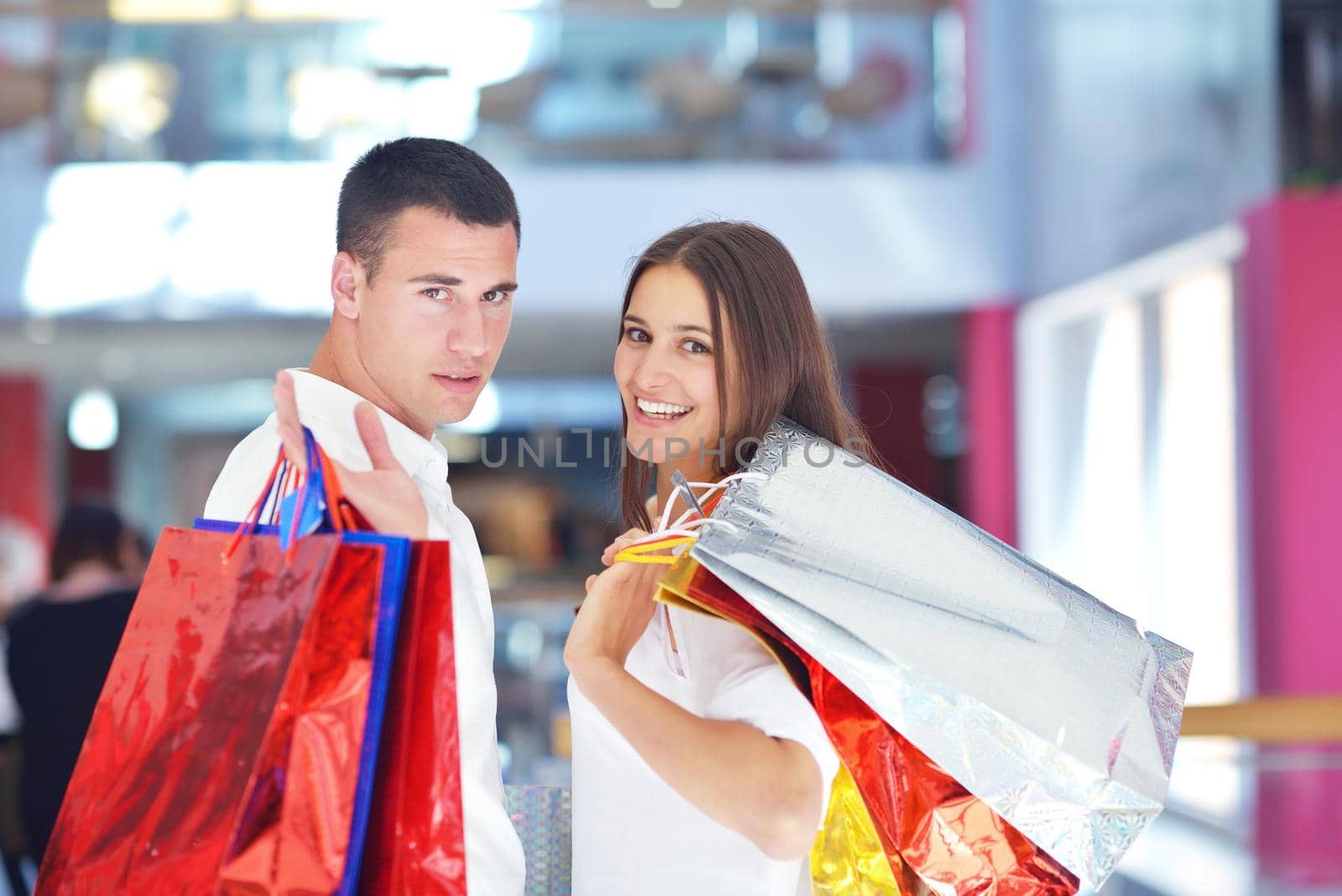 happy young couple in shopping by dotshock