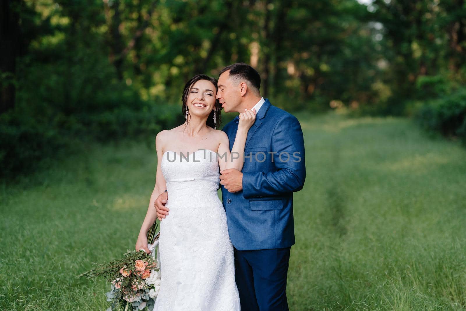 A couple in love a guy and a girl on a walk in the forest belt