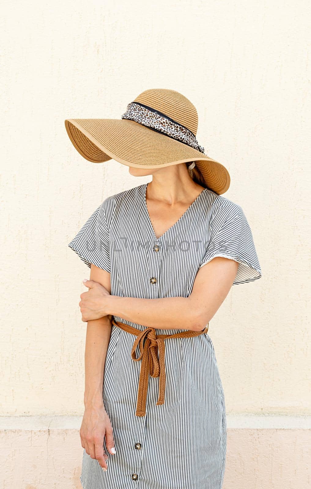 Portrait of a beautiful woman in elegant summer hat by Desperada