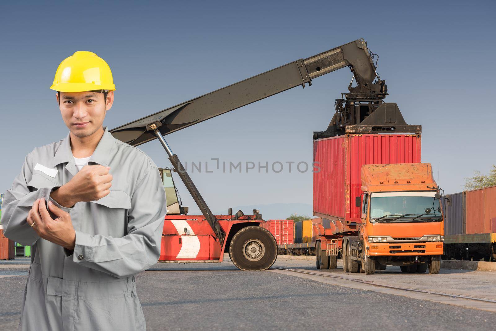 Foreman stand on front forklift loading Containers box to Logistic cargo Import Export