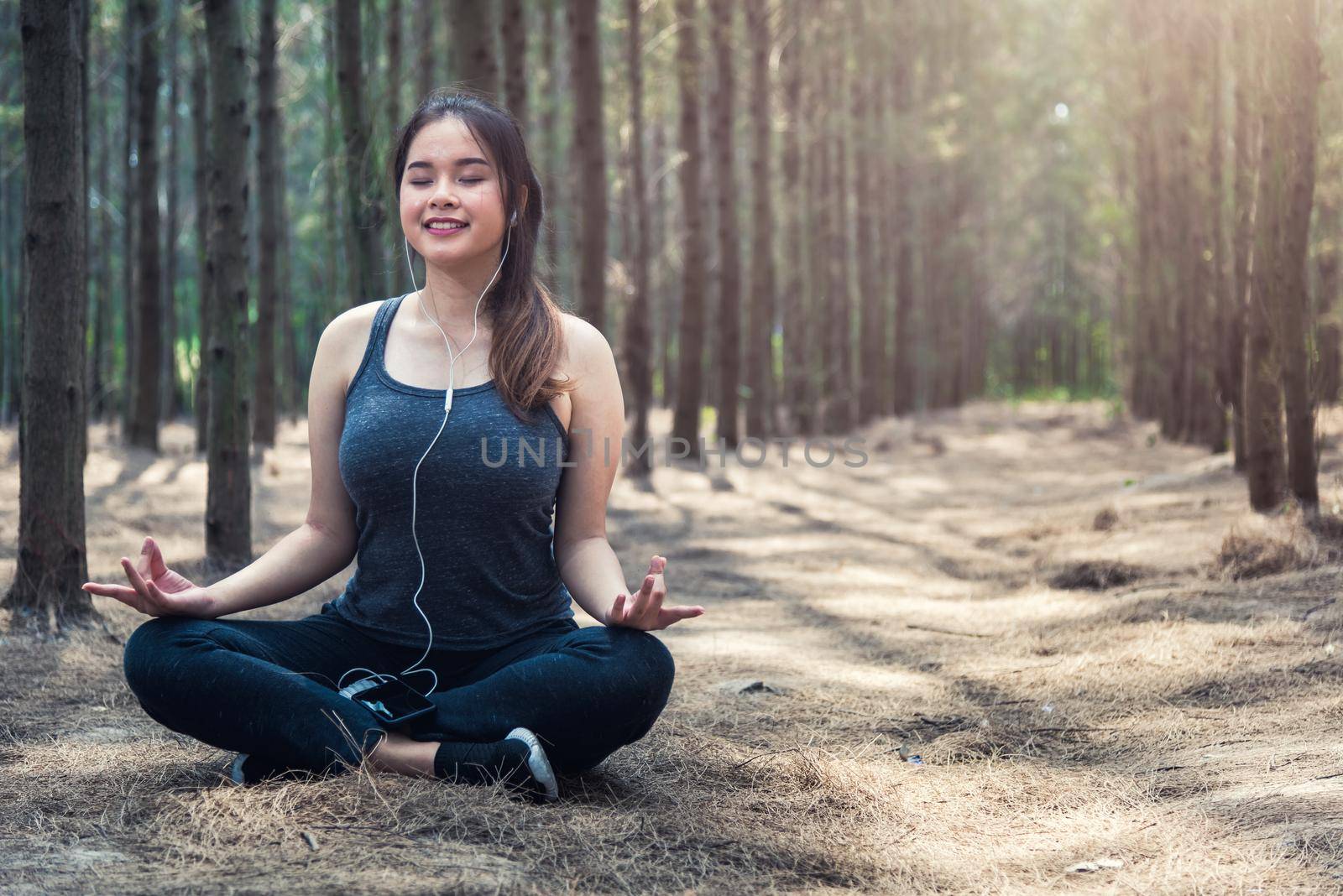 Beautiful young woman relaxation sitting meditation exercise yoga  by Sorapop